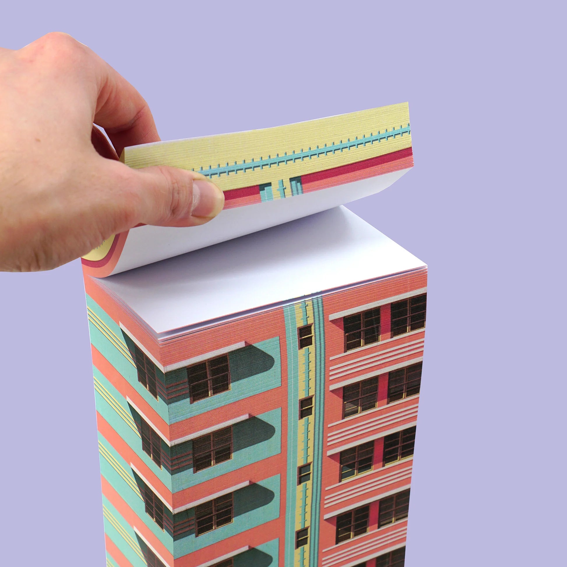 Paperscraper Miami│Memoblok│hand houdt bovenste blaadjes vast