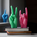 Candlehand You Rock Kaars│art. RCK-PINK│naast groen Peace versie op boeken