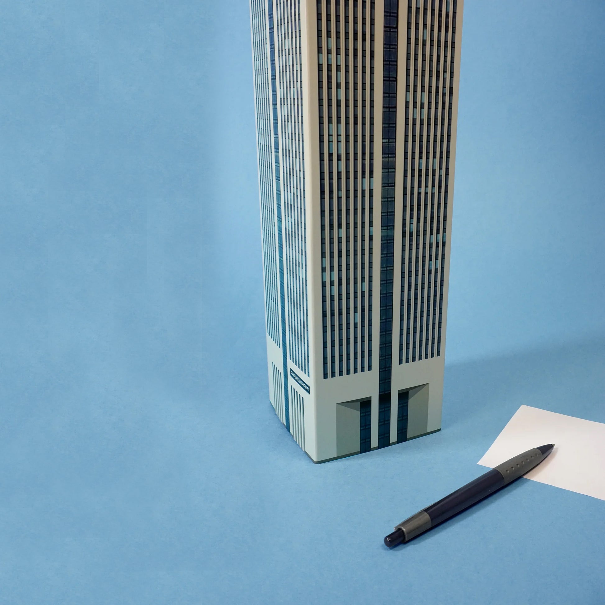 Memoblok Paperscraper Skyscraper Downtown│onderkant met los vel papier en pen