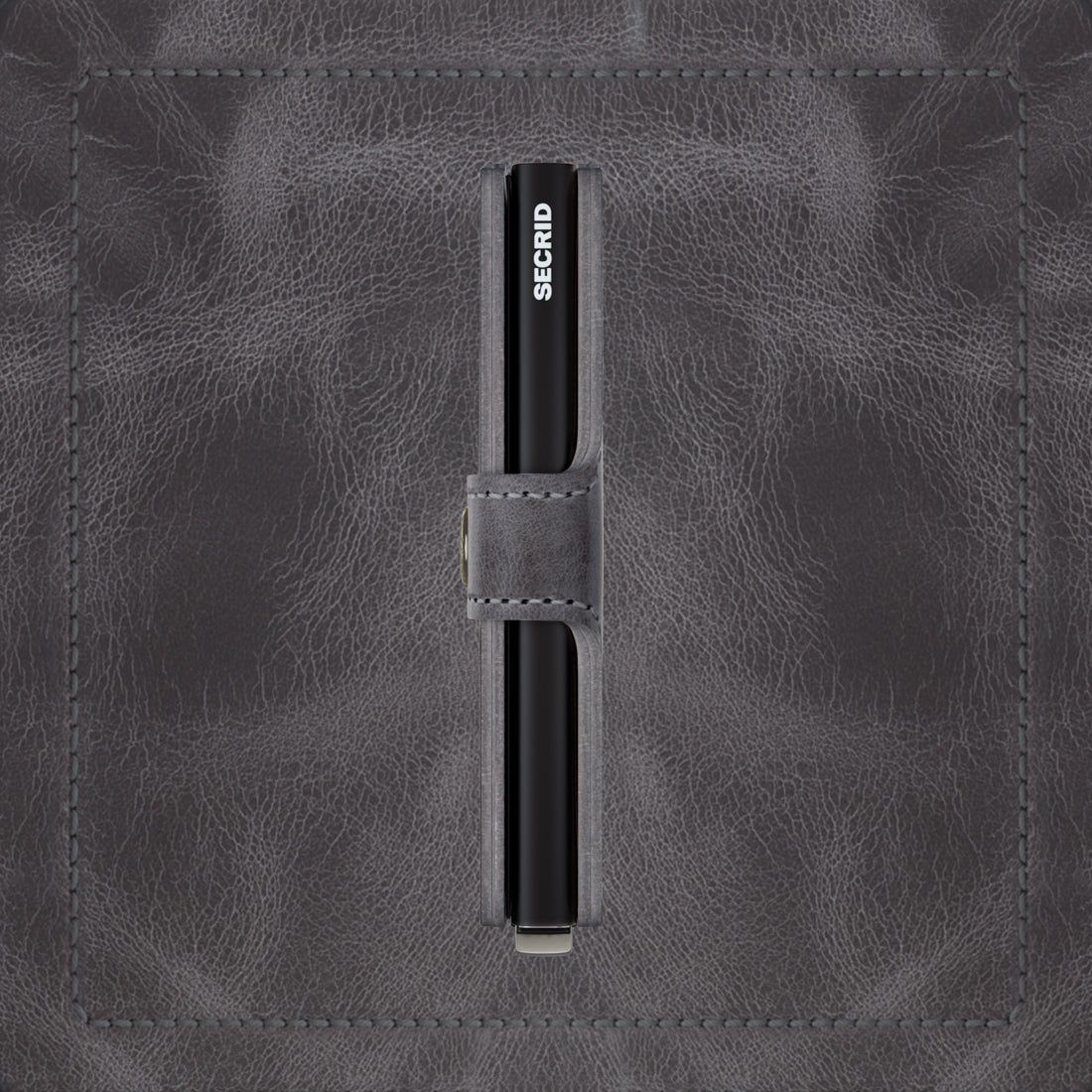 Secrid Miniwallet Vintage│art. MV-GREY-BLACK│pasjeshouder│zijkant met leersoort op achtergrond