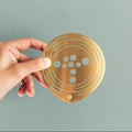 Flower Constellations Messing Medium│House of Thol│in hand vastgehouden