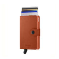 Secrid Miniwallet Crisple│Pasjeshouder│art. MC-PUMPKIN│voorkant met uitgeschoven pasjes en clip