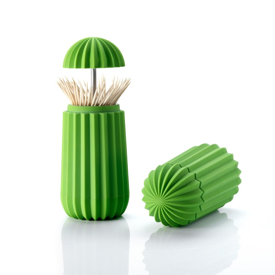 Een houder voor tandenstokers en cocktailprikkers in de vorm van een cactus. Met een druk op de bovenzijde opent deze cactus zich. Je tandenstokers altijd hygiënisch opgeborgen in dit functionele en originele en symbolische ontwerp.