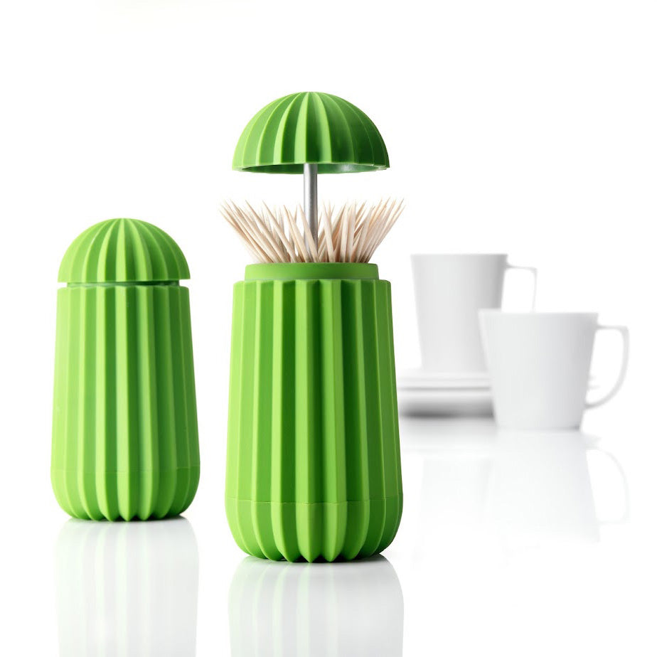 Een houder voor tandenstokers en cocktailprikkers in de vorm van een cactus. Met een druk op de bovenzijde opent deze cactus zich. Je tandenstokers altijd hygiënisch opgeborgen in dit functionele en originele en symbolische ontwerp.