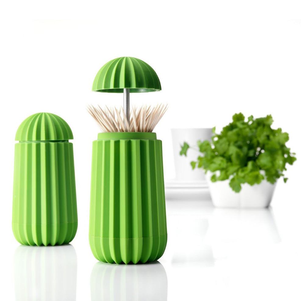 Een houder voor tandenstokers en cocktailprikkers in de vorm van een cactus. Met een druk op de bovenzijde opent deze cactus zich. Je tandenstokers altijd hygiënisch opgeborgen in dit functionele en originele en symbolische ontwerp.