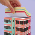 Paperscraper Miami│Memoblok│met hand met bovenste deel vastgepakt
