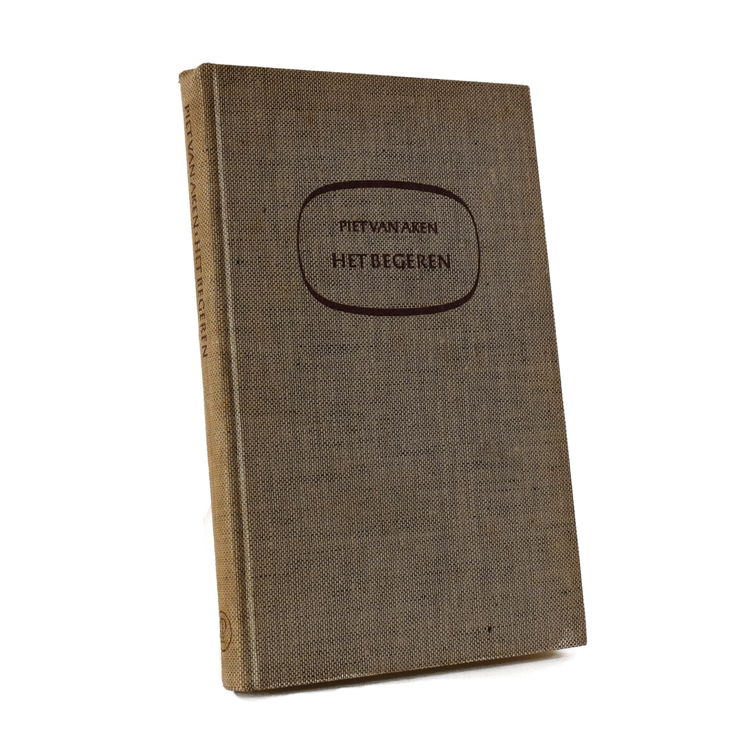 About Blanks notitieboek van de beige linnen kaft van Het begeren van Piet van Aken, vooraanzicht schuin