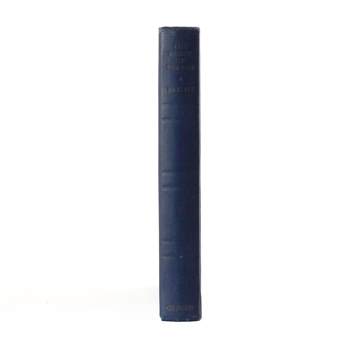 The notebook standing on its side, with the title The Spirit of the Age on the spine