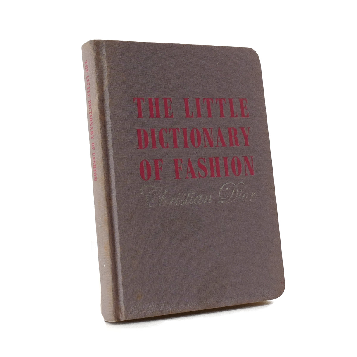 About Blanks notitieboek van de turquoise linnen kaft van The Little Dictionary of Fashion, vooraanzicht schuin