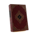 About Blanks notitieboek van de donkerrode skai kaft met gouden ornamenten van Le Bal des maudits, vooraanzicht schuin