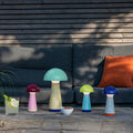 Remember Bobbi Oplaadbare LED Tafellamp | in blauw, geel en berry met Bob Mint buiten op tafel voor een loungebank