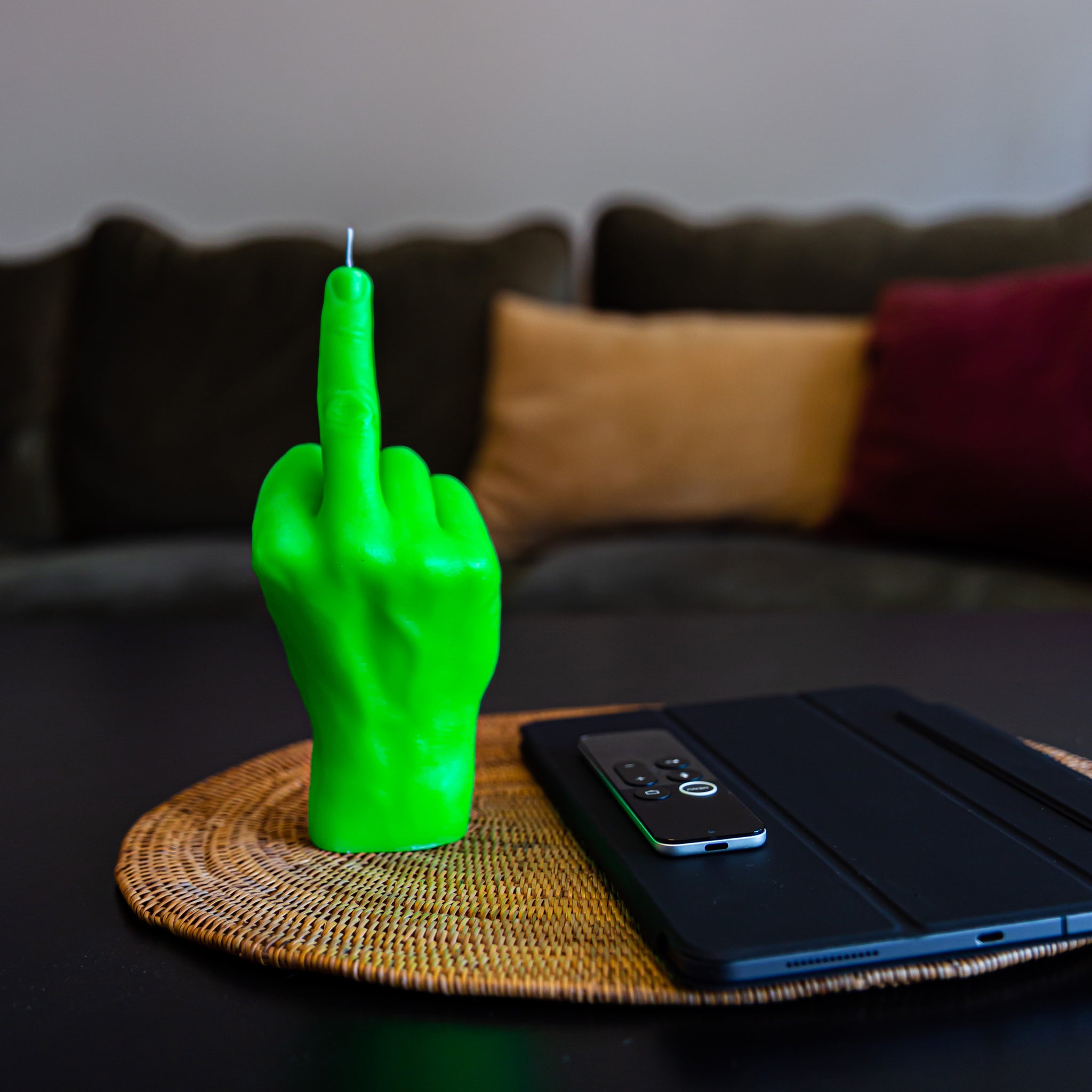 Candlehand Fuck You Kaars Neon Groen│art. FCK-NEO-GREEN│op tafel naast Ipad