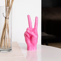 Candlehand Peace Kaars│art. VIC-PINK│op tafel naast vaas