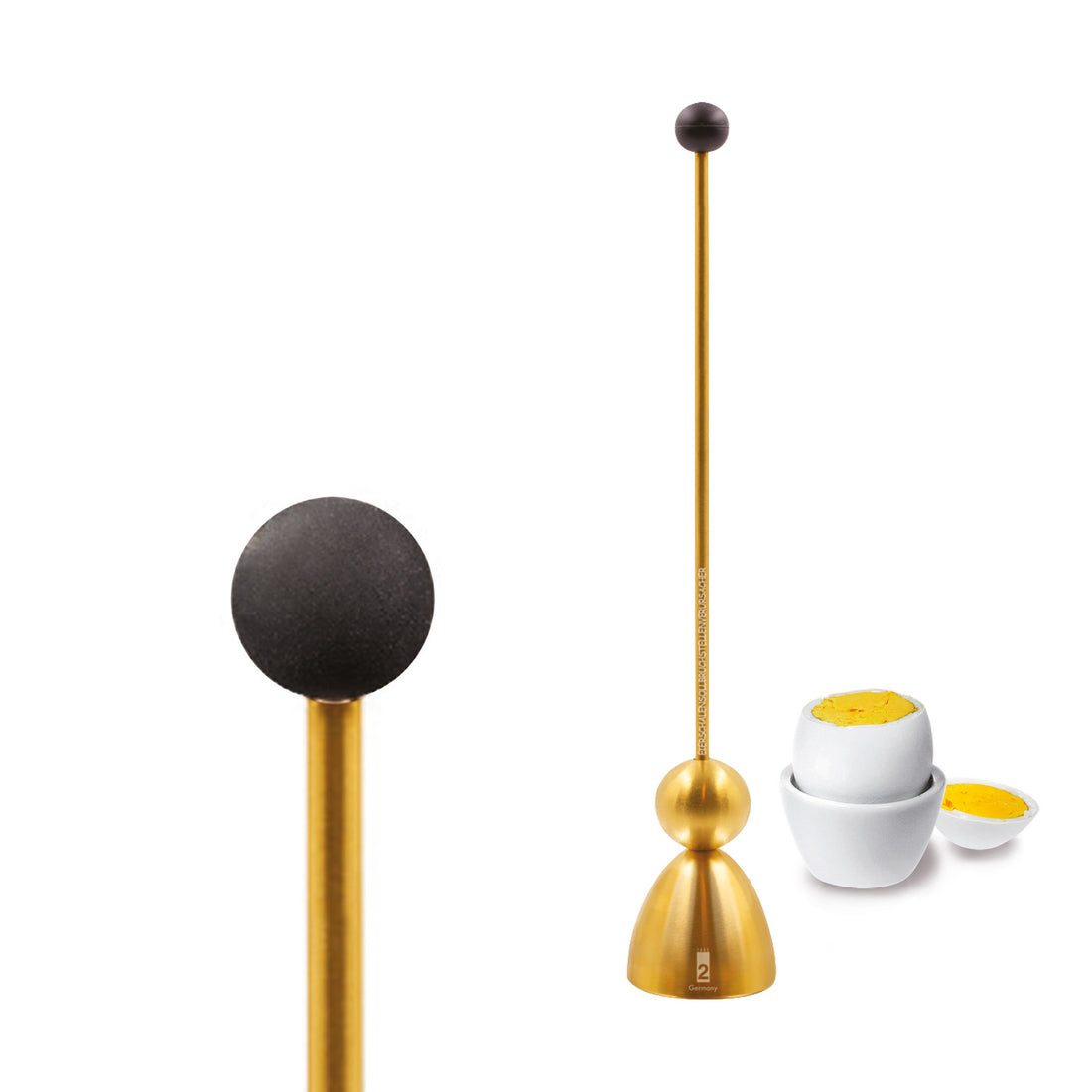 Clack egg topper in matt gold, close up with a boiled egg in an egg cup in the background.