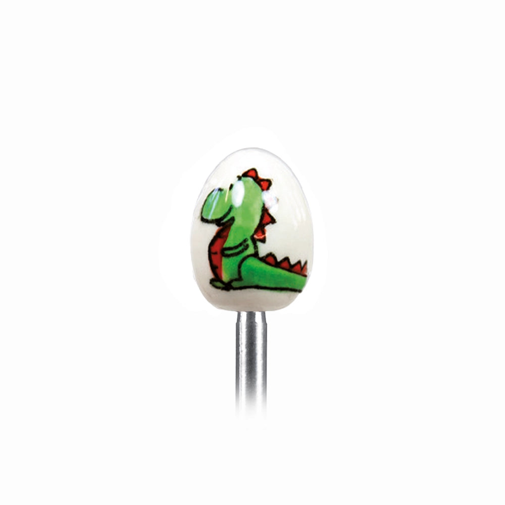 Clack egg topper with a ceramic egg with a dragon, close up beside a boiled egg.