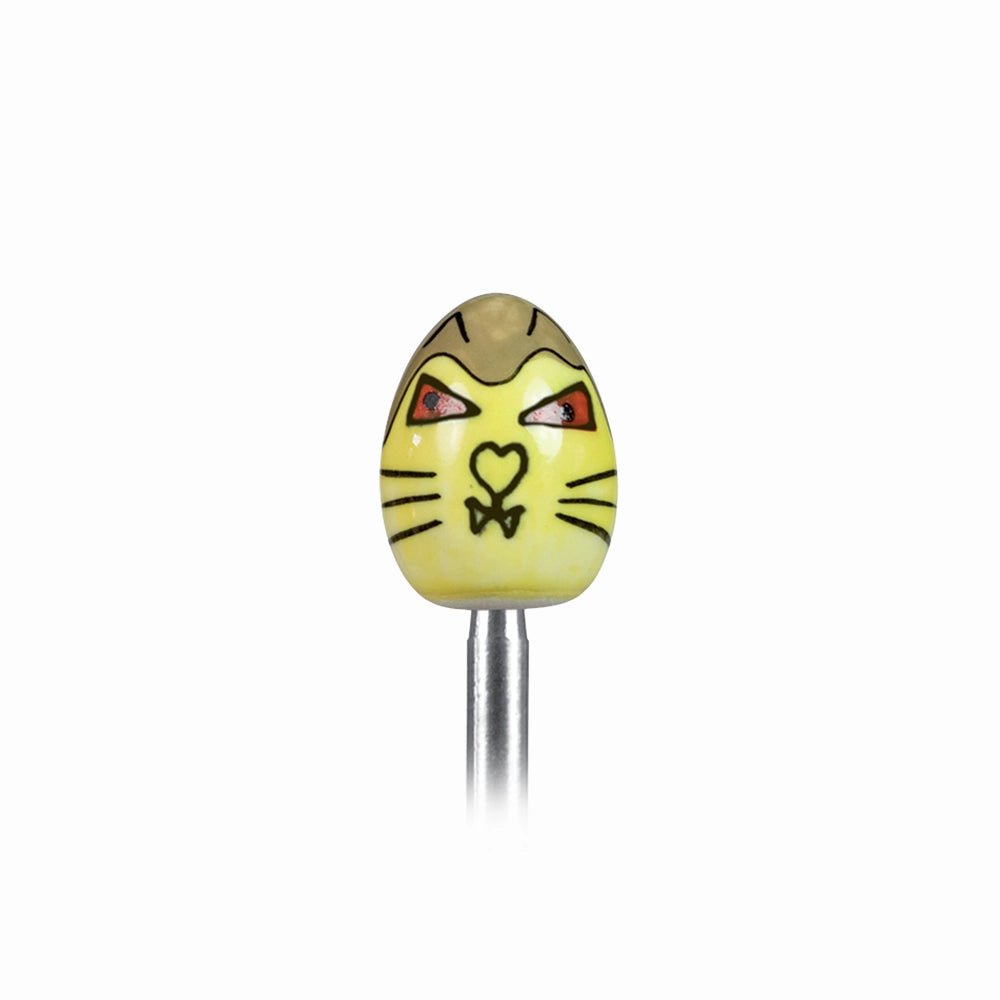 Clack egg topper with a ceramic egg with a cat, close up with a boiled egg in the background.