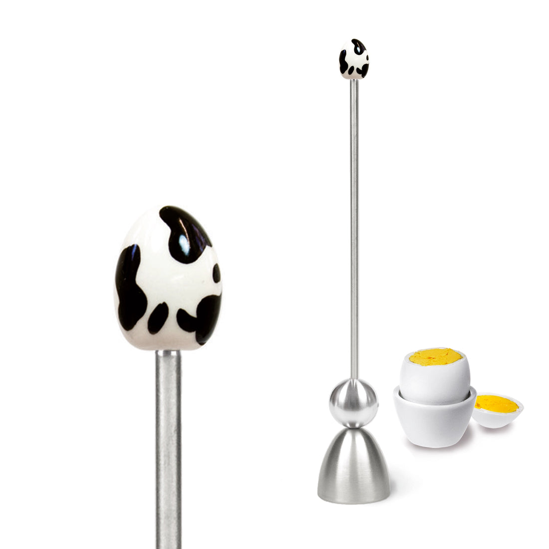Clack egg topper with a ceramic egg with cow markings, close up beside a boiled egg.