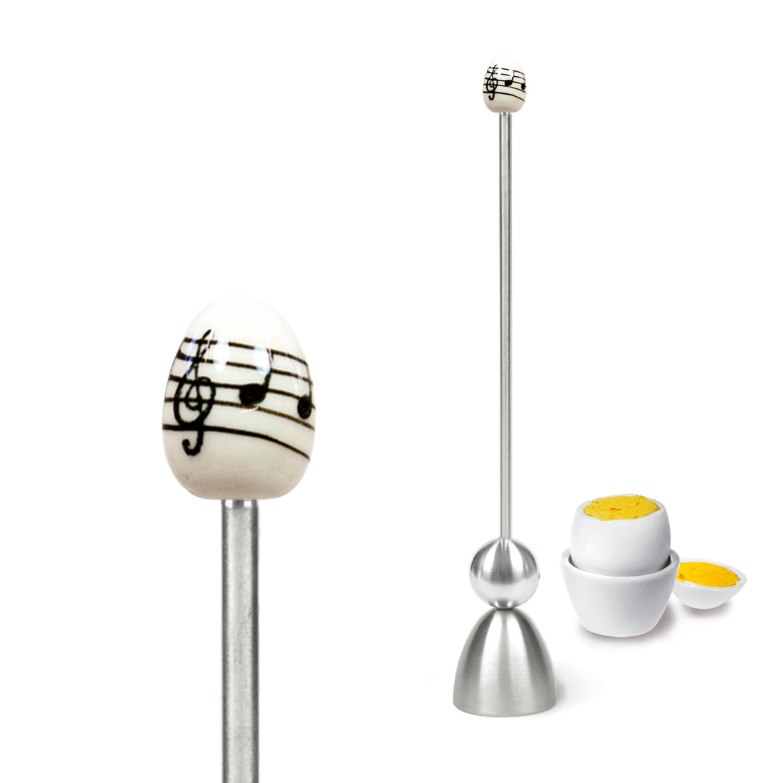Clack egg topper with a ceramic egg with musical notes, close up beside an egg cup.