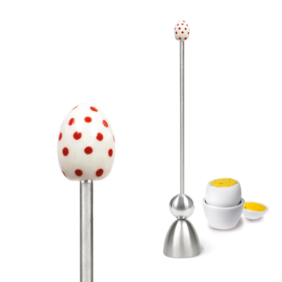 Clack egg topper with a ceramic egg with red spots, close up beside a boiled egg.