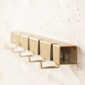 Detail haakje en open buis van Wandkapstok Coatrack by the Meter 50cm Goud
