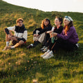 Insulated Bottle 350 ml Maple Yellow (yellow) - group of hikers sitting in the grass with insulated bottles in hand