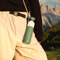 Insulated Bottle 350 ml Pine Green (green) - close-up of the bottle worn on a cord at the hip