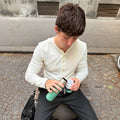 Insulated Bottle 350 ml Pine Green (green) - man pouring water into the cup on the street