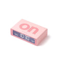 Bovenkant schuin van de Lexon Flip Mini Roze met On zijde boven