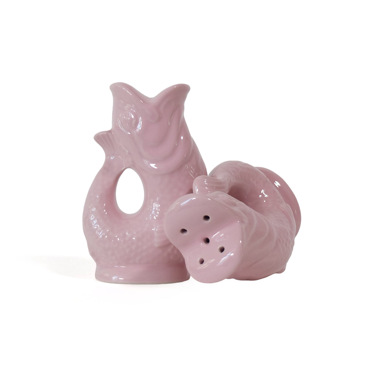 Gluckigluck salt and pepper shakers shaped like fish, in pink, standing and lying down.