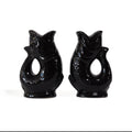Gluckigluck salt and pepper shakers in black, the two fish facing each other.