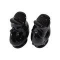 Top view of the Gluckigluck salt and pepper shakers in black, showing the holes.
