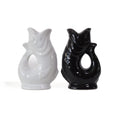 Gluckigluck salt and pepper shakers in black and white, the two fish facing each other.