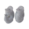 Top view of the Gluckigluck salt and pepper shakers in Oyster, showing the holes.