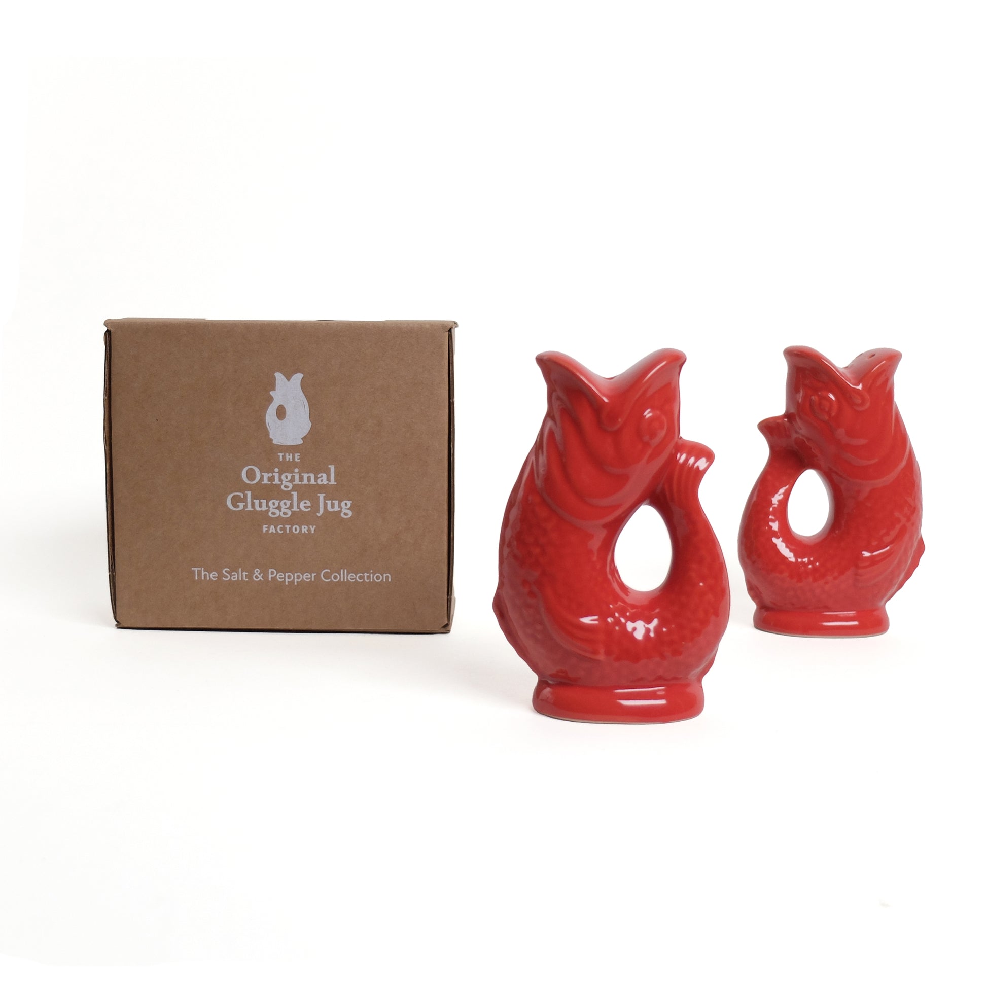 Gluckigluck Peper en Zoutstel Rood│art. G1159/RED/W│staand naast verpakking