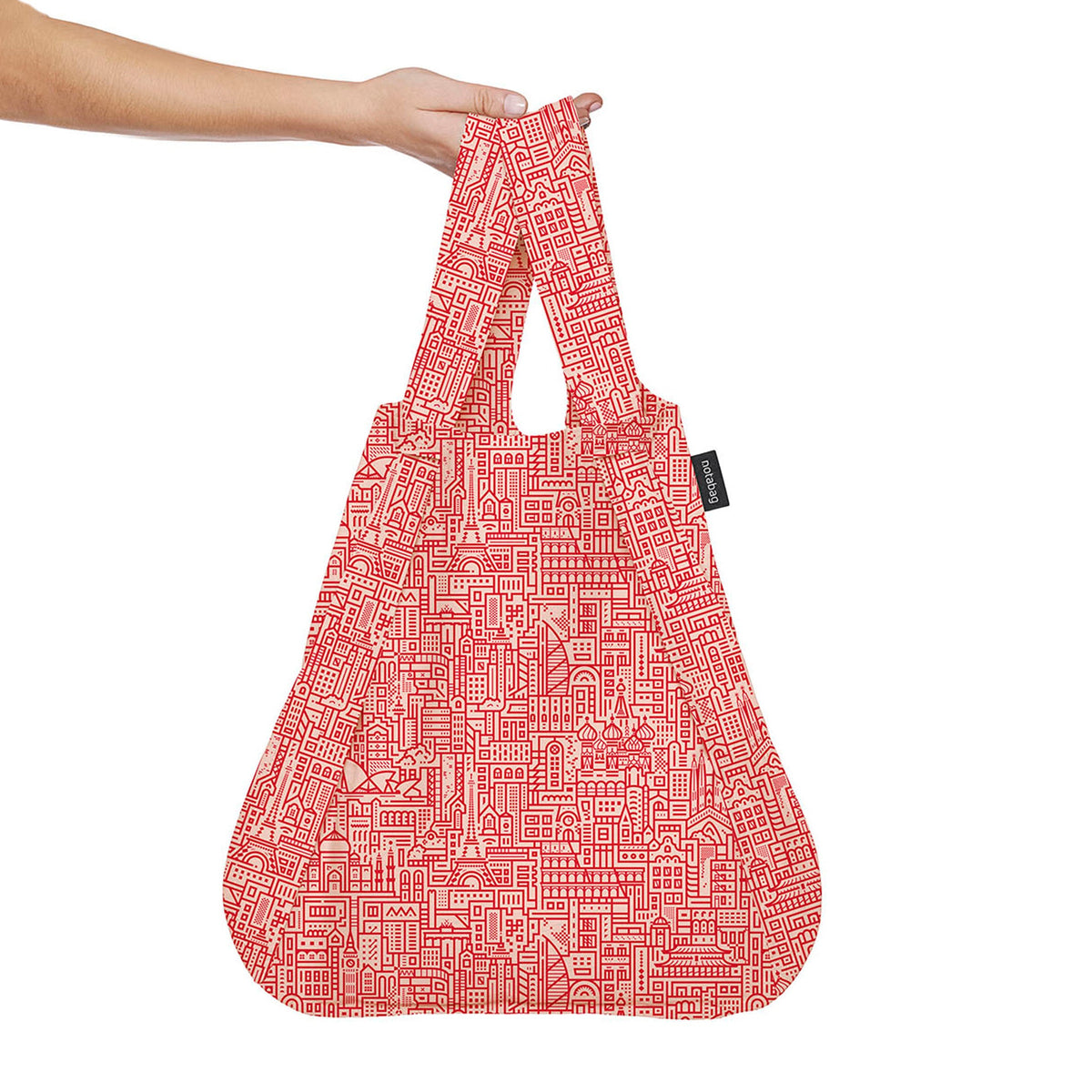 Notabag Hello World Rose Red shopper vastgehouden in de hand