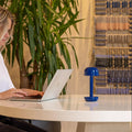 Humble Two Oplaadbare Tafellamp Cobalt Blue│op witte tafel naast laptop│art. HUMTL00219