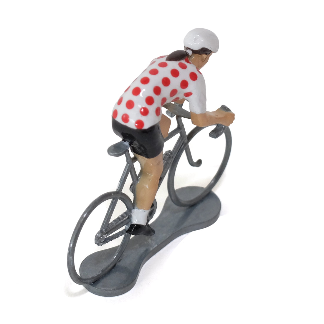 Miniatuur wielrenster in de bolletjestrui van Bernard & Eddy, van opzij