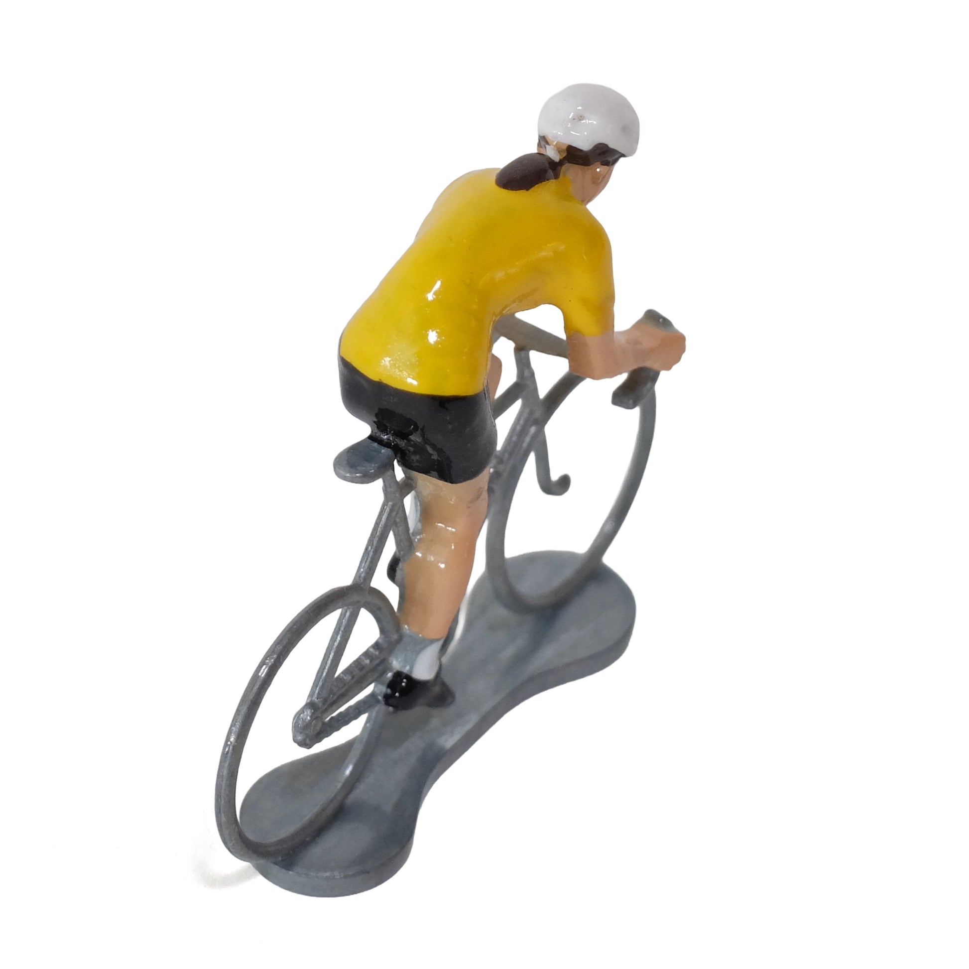 Miniature female cyclist in the yellow jersey by Bernard & Eddy, seen from behind