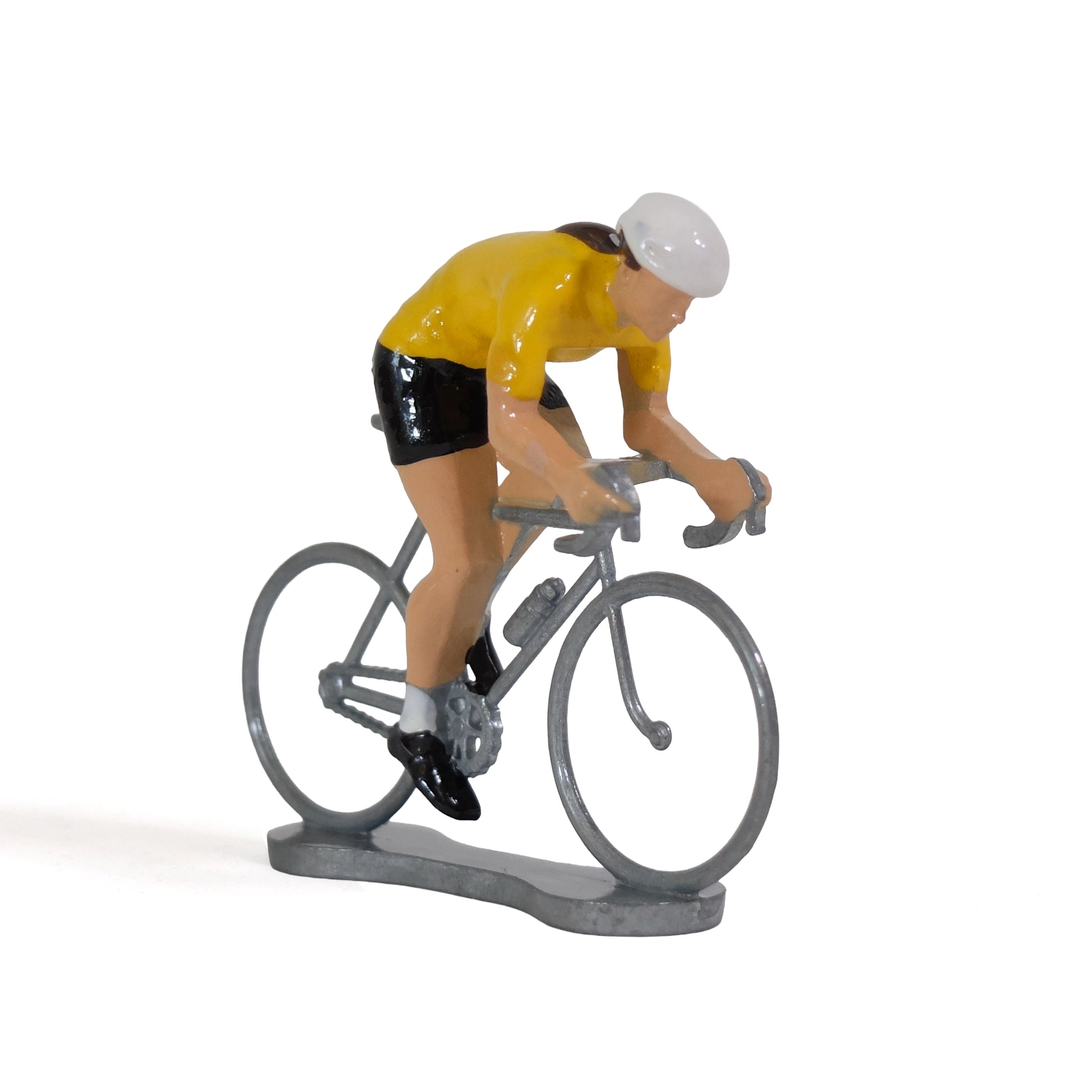 Miniature female cyclist in the yellow jersey by Bernard & Eddy, at an angle from the front