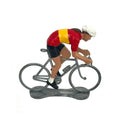Miniature female cyclist in the Spanish champion's jersey by Bernard & Eddy, seen from the side