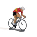 Miniature female cyclist in the Spanish champion's jersey by Bernard & Eddy, at an angle from the front