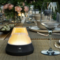 Salerno Zwart Oplaadbare Tafellamp│Buitenverlichting│Leonardo│art. 76030│met warm licht aan op buitentafel
