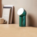 Lexon Orbe Donkergroen│Oplaadbare Tafellamp│art. LH88DG1│op bureau me twit licht aan