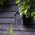 Multiholk Carbon Black Vogelhuis│Wildlife Garden│art. WG1127│zijaanzicht schuin tegen zwart schuurtje