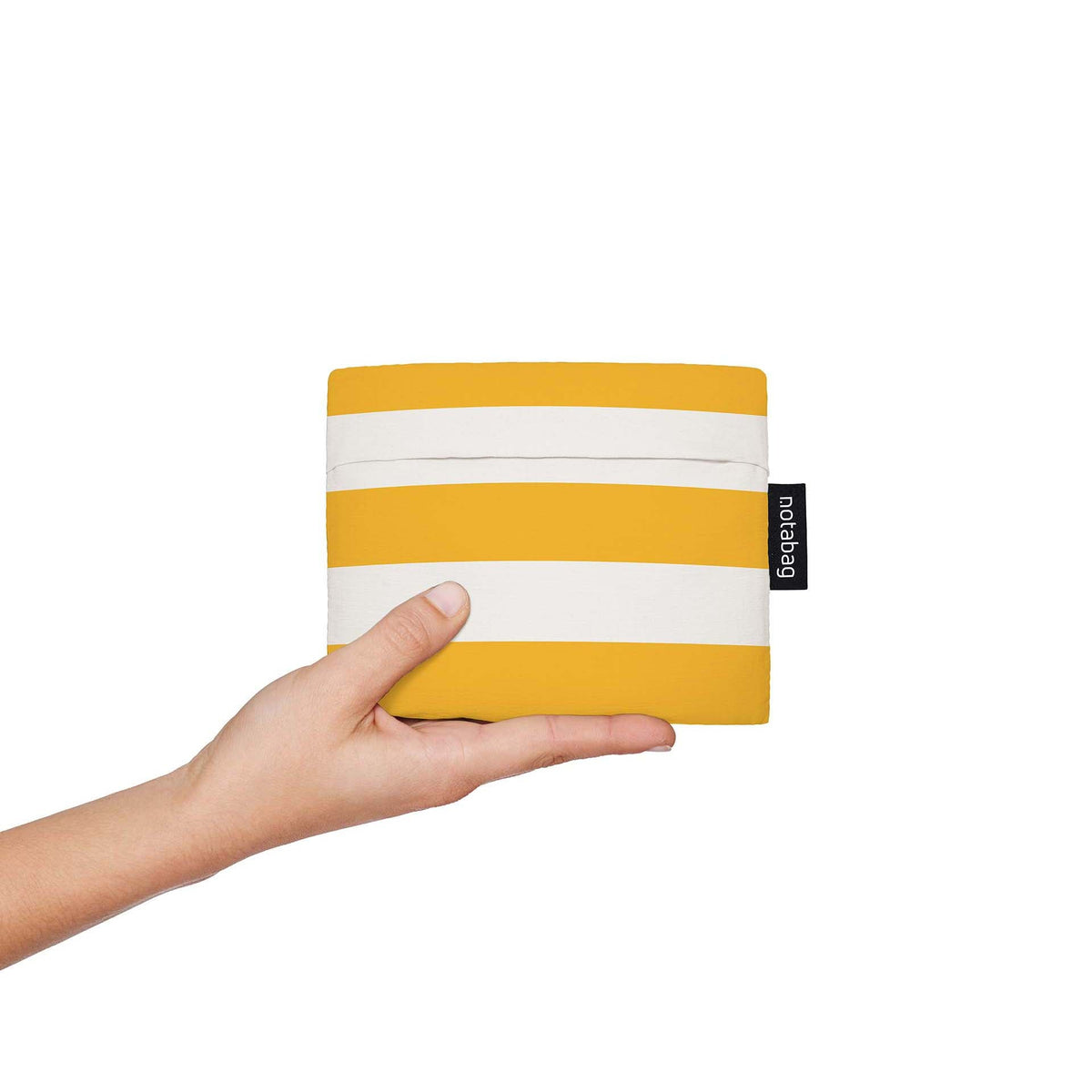 Notabag Golden Stripes opgevouwen in de hand