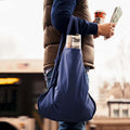 Navy blue Notabag worn over the arm