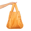 Notabag Recycled Mosterd Geel shopper gedragen in de hand