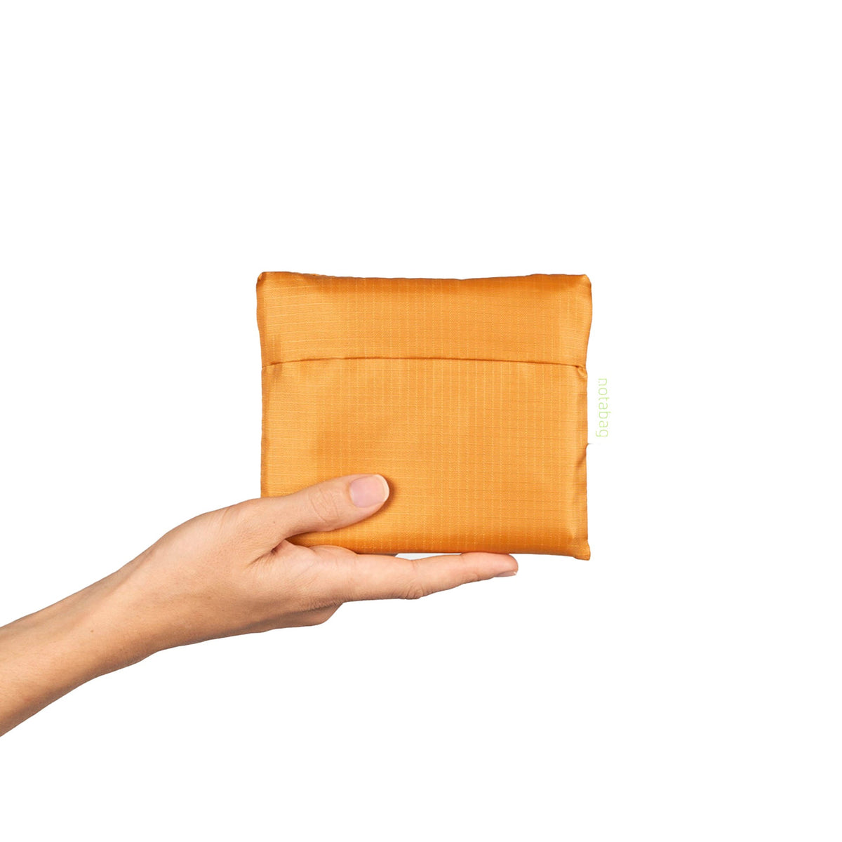 Notabag Recycled Mosterd Geel opgevouwen in het bijhorende tasje