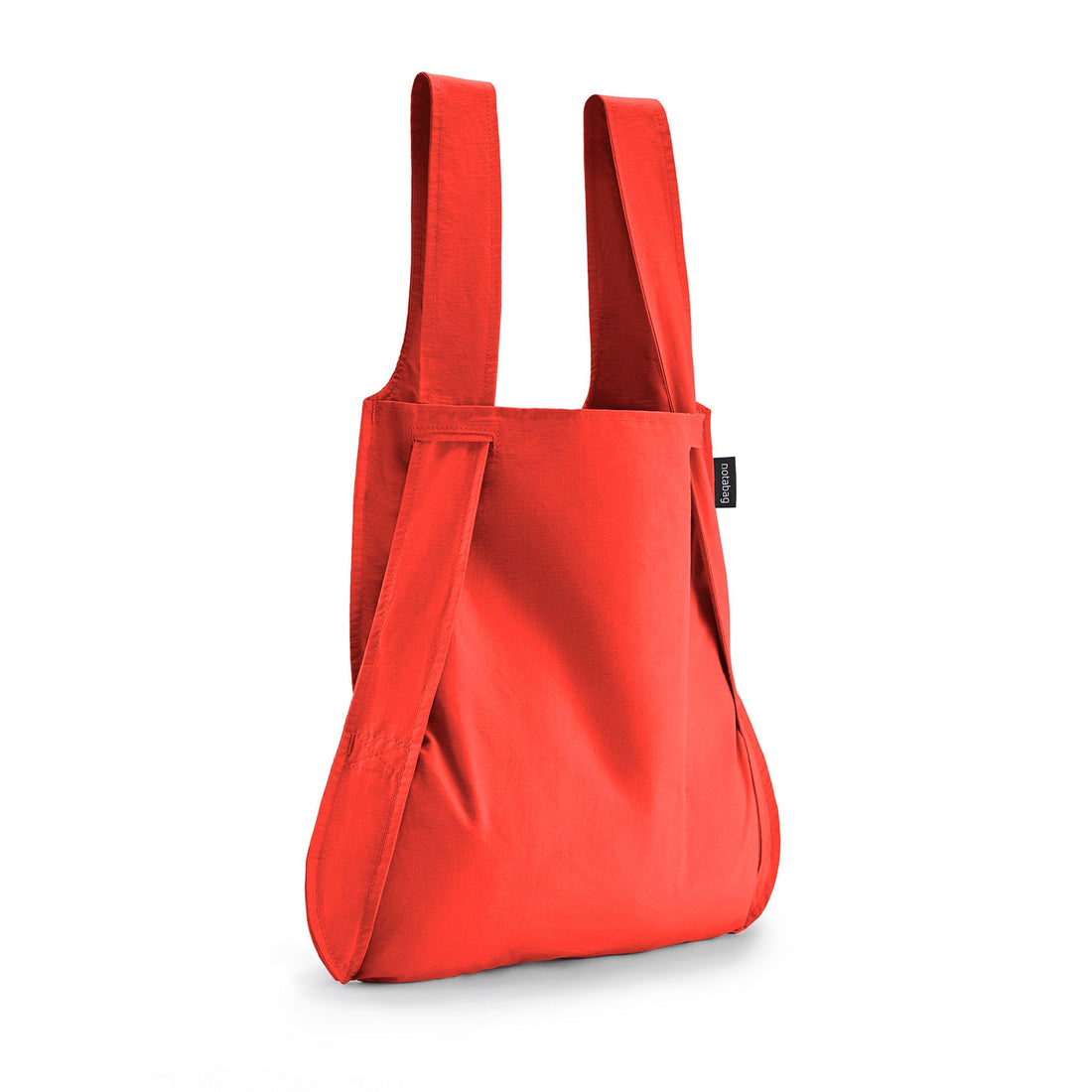 Red Notabag as a shopper bag against a white background