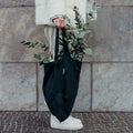 Black Notabag held with plants inside